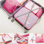 hot pink cubes in a suitcase with a close-up of the mesh top and zipper